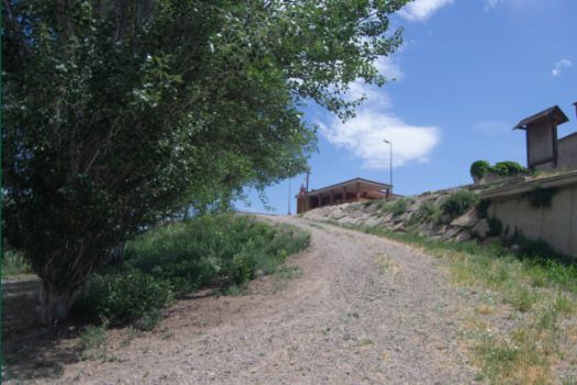 Downward ramp from the street to the bank of the River Segre 