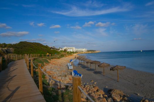The beach of Binicodrell is walked on a wooden platform